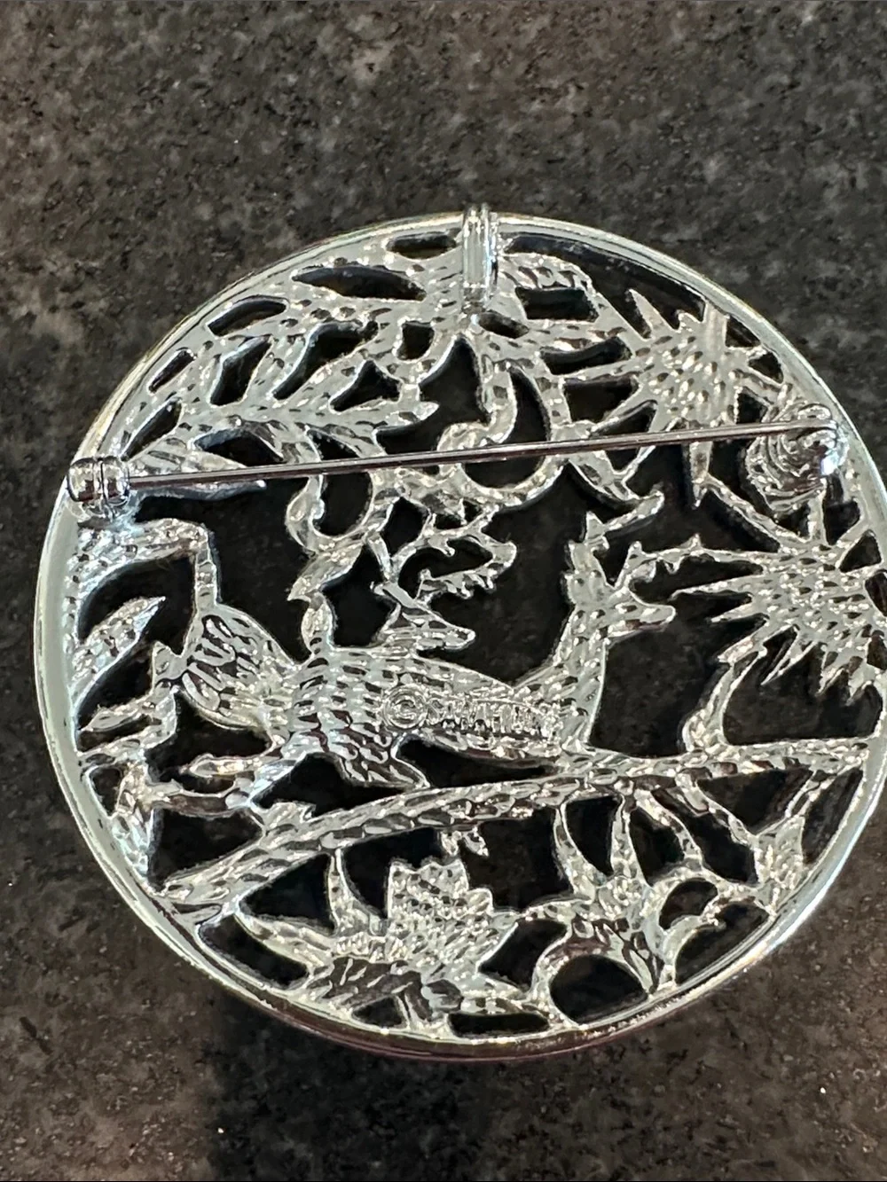 Sarah Coventry Christmas brooch, featuring deer and pine bows